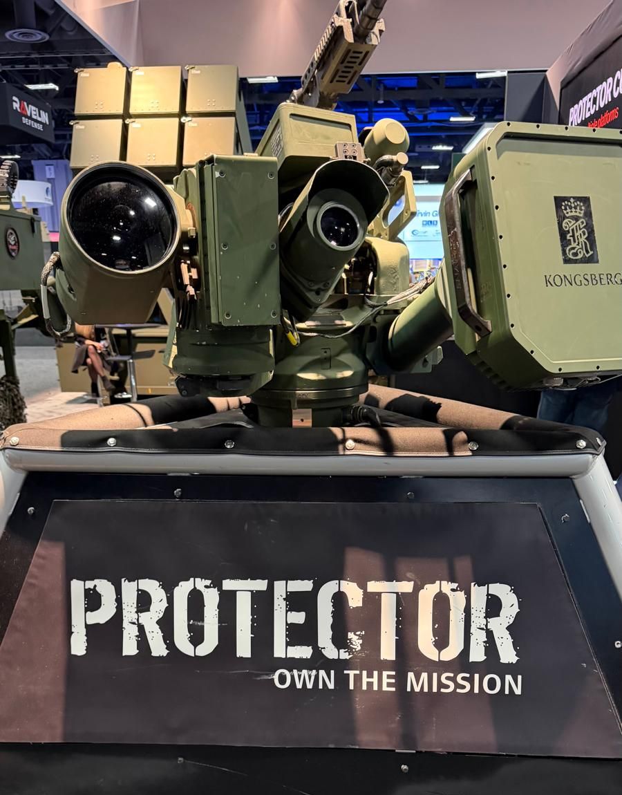 Kongsberg Protector remote weapon station with optical sights and sensor panels, above a PROTECTOR banner