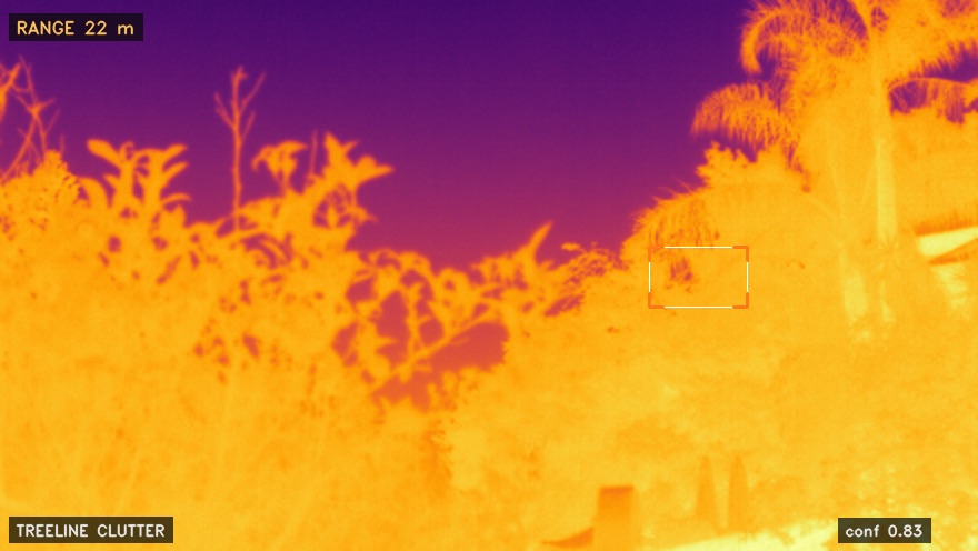 GOTEAM thermal detection of a drone resolved against hot treeline clutter, box-locked at 22 metres with 0.83 confidence.