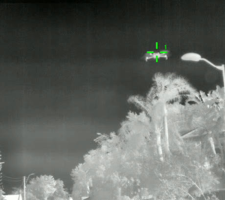 Real annotated thermal frame — a drone locked by the live tracker